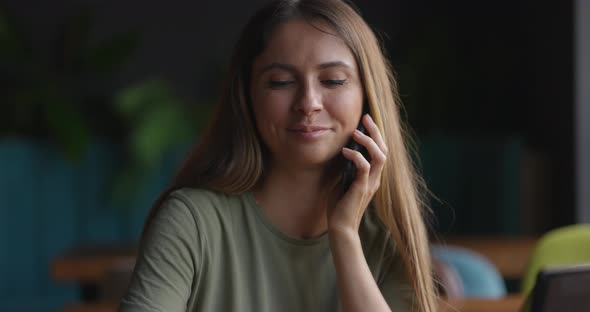 Smiling Young Business Woman Professional Talking on Phone Sit at Cafe Desk Happy Female Customer