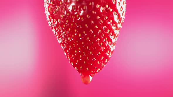 Slow Motion Macro Shot of Flowing Juice From Strawberry