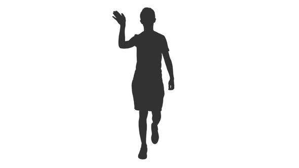 Silhouette of Young Man Waving Hand Hello While Walking