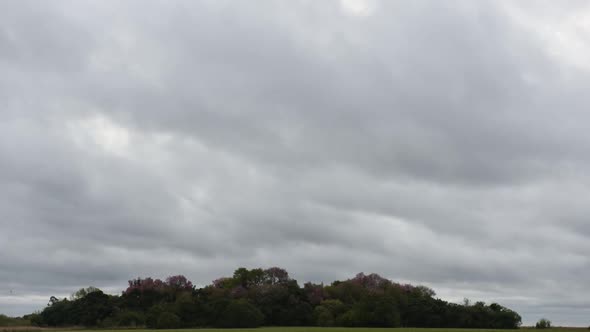 Time lapse of clouds moving over landscape