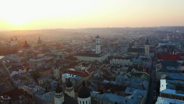 Aerial Drone Video of Lviv Old City Center, Roofs and Streets, City Hall Ratusha