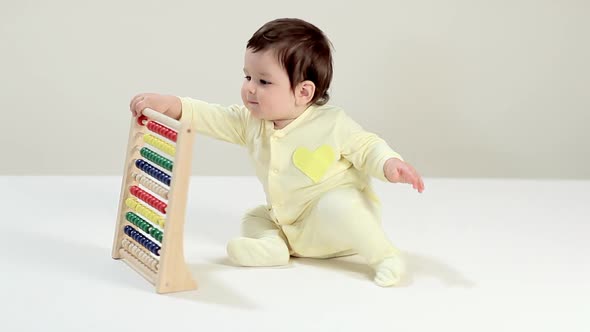 Baby boy playing with abacus