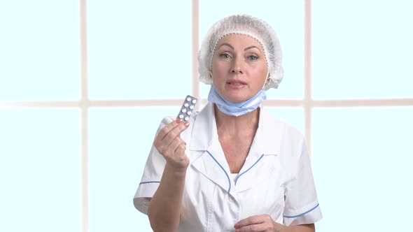 Female Doctor Showing Blister of Pills.