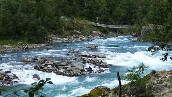 Wild clear blue stream in Morkidsdalen park Skjolden 