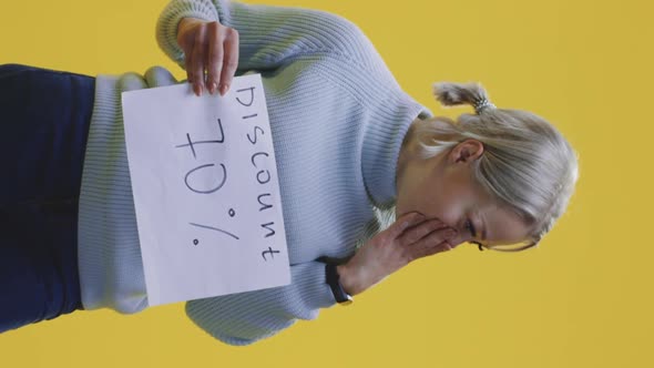 Woman Holding 70 Percent Discount Sign