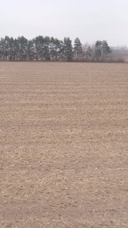 Vertical Video of a Field with Plowed Land in Autumn Slow Motion
