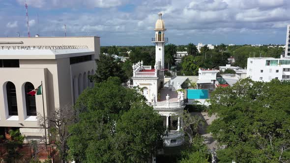 Aerial trucking shot to the right of the el Minaret mansion on the Paseo de Montejo in Merida, Yucat