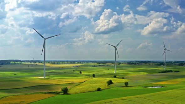 Wind turbines with blue sky in countryside, aerial view in Poland