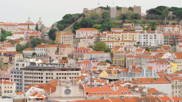 Lisbon Portugal Cityscape with Historic Sao Jorge Castle and Old Town at Sunset