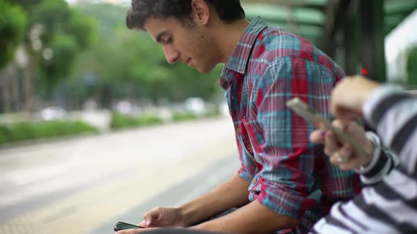 Man using smartphone outdoors