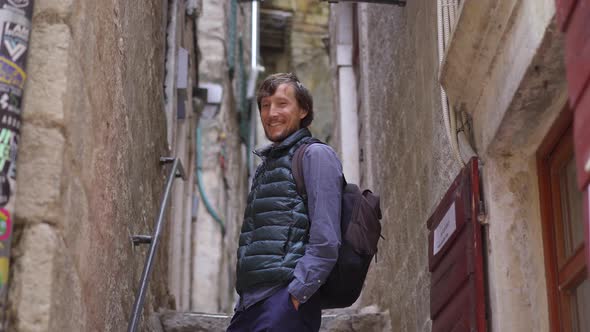 A Young Man Visits the Old Town of Kotor in Montenegro