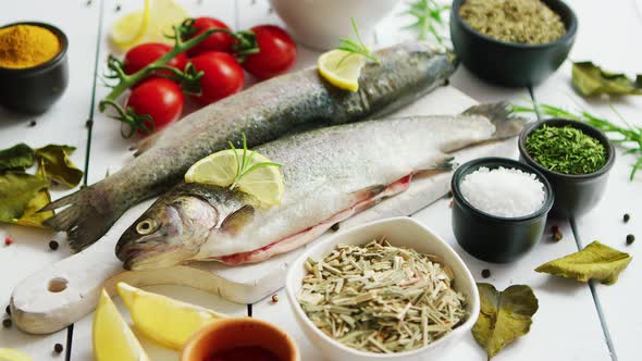 Spices and Tomatoes Around Fish