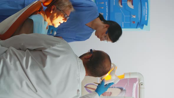 Vertical Video Professional Dentist Working with Gloves During Examination