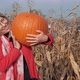 Young Girl Chooses a Pumpkin for Halloween - VideoHive Item for Sale