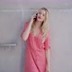 Stylish Female Speaking on Smartphone Near Concrete Wall - VideoHive Item for Sale