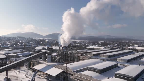 Drone Flies Over the Industrial Area Close to Factory Flying Through Smoke From the Pipes Aerial