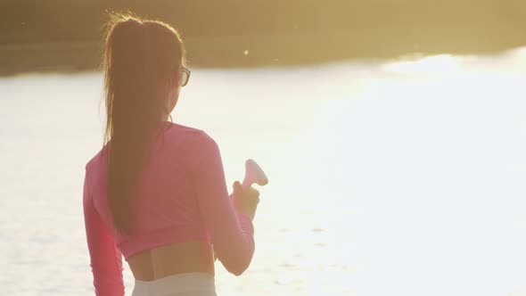 Back View of Woman Practising in Sup Boarding on City Lake