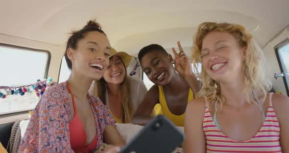 Young adult friends in a camper van 4k