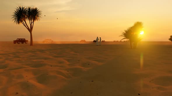 Vehicle Convoy on Dusty Road in the Desert with Sunset Landscape