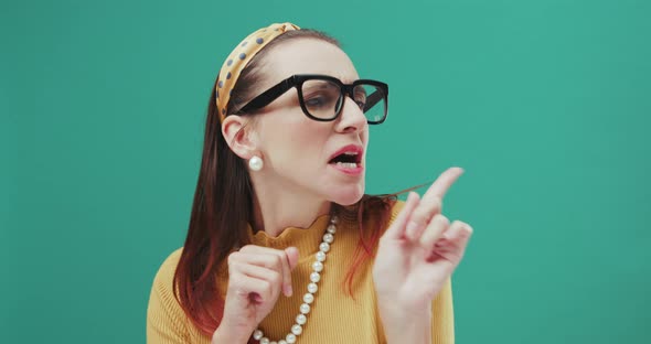 Funny Sixties style woman dancing while pretending to play drums. Isolated.