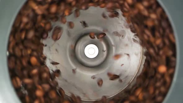 HD - Coffee grinder grinds coffee beans. Slow-mo