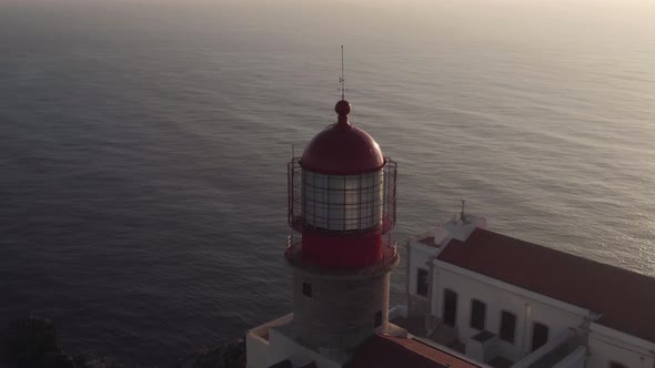 Tower of the Lighthouse of Cabo de Sao Vicente, Sages, Algarve, Portugal. Medium aerial shot