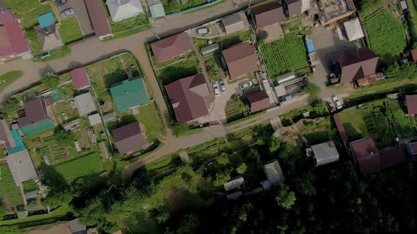 Flight Over the Village Near the Green Forest