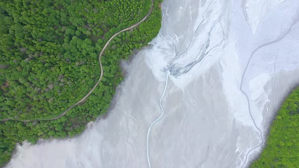 Flying Over a Giant Decanting Lake Full With Mining Waste Residuals Flooding Into a Settling Basin