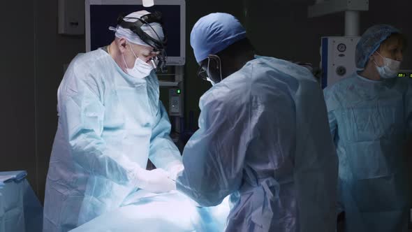 Diverse surgical team performing operation