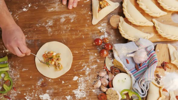 Man Cooking Empanadas Argetinian Pie Traditional Bakery From Argentina Chef Filling Dough in Home