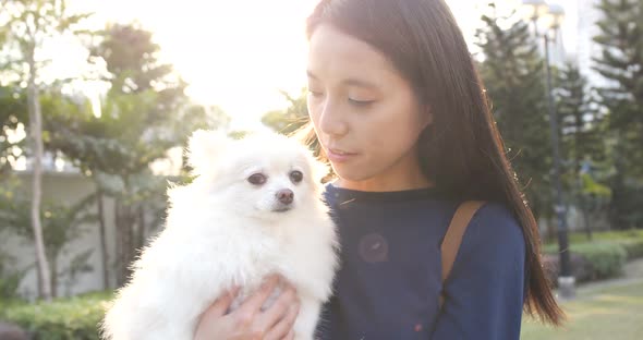 Woman being with her dog in the park