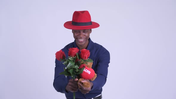 Young Happy African Businessman Giving Gifts Ready for Valentine's Day