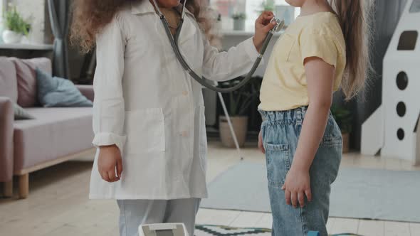 Adorable Little Girls Playing Doctor and Posing