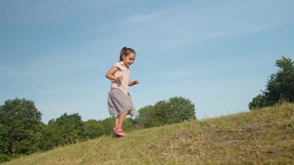 Little Girl Runs Up the Hill