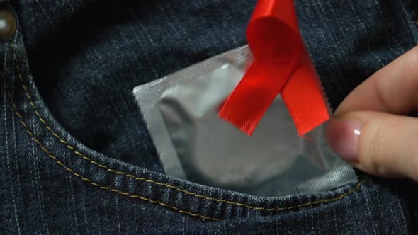 Condom With Red Ribbon in Pants, Safe Sex to Prevent AIDS and Sti, Healthcare