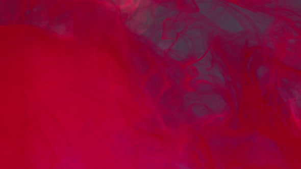 Red ink diffusing in water alt