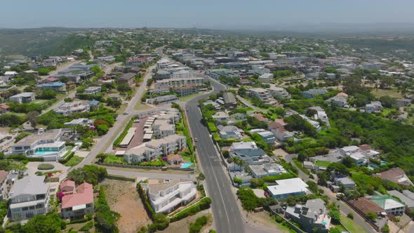 Backwards Reveal of Buildings Along Road in Urban Neighbourhood