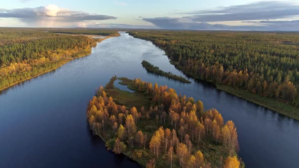 Finland. Flying Over Island and River Among Forest in Autumn. Aerial Shot, 