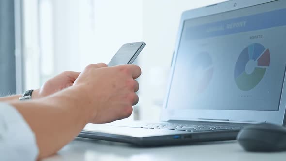 Trader Man Using Cellphone And Checks Report Data