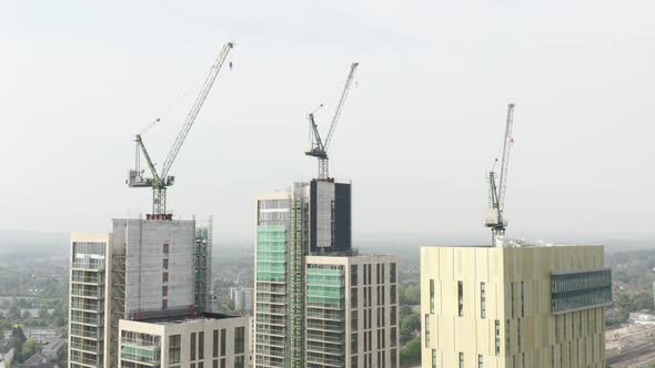 Drone Aerial shot of Woking Cityscape a town in England with high rise skyscrapers and cranes with d