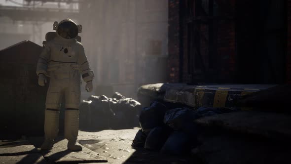 Lost Astronaut Near Abandoned Industrial Buildings of Old Factory