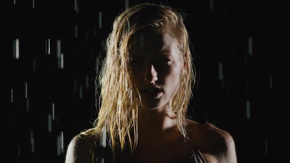 Athletic Blond Woman Working Out In The Rain