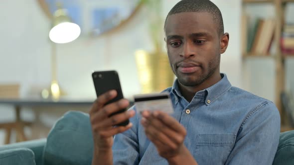 Online Shopping on Smartphone By African Man