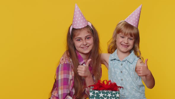 Happy Children Sister Girl Siblings Friends Kids Celebrating Birthday Party Holding Gift Box Present