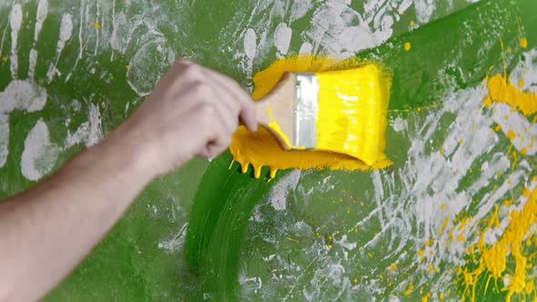 Painting White and Green Wall with Yellow Color Paint