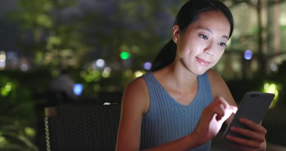 Woman use of smart phone in outdoor cafe