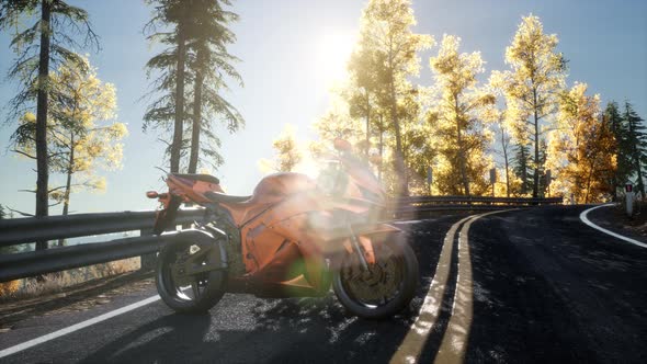 Sportbike on Tre Road in Forest with Sun Beams