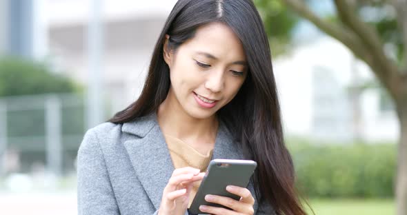 Woman use of mobile phone at night