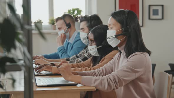 Portrait of Asian Woman Working at Call Center