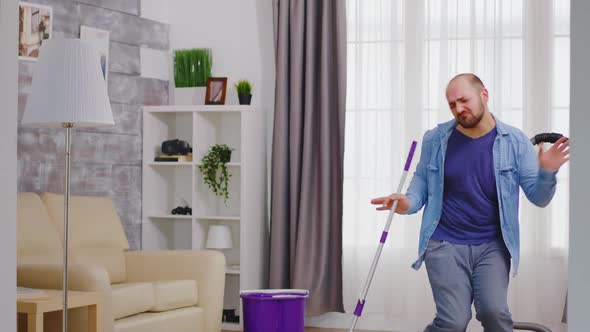 Guy Dancing and Cleaning